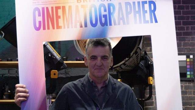Henry Braham holding a British Cinematographer sign