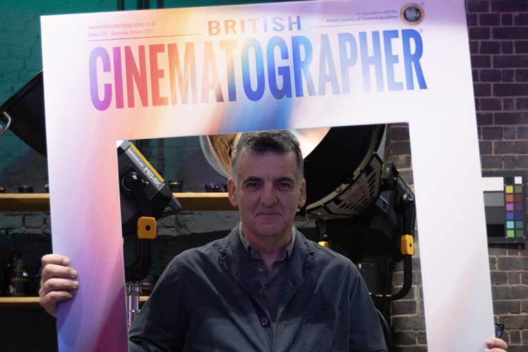 Henry Braham holding a British Cinematographer sign