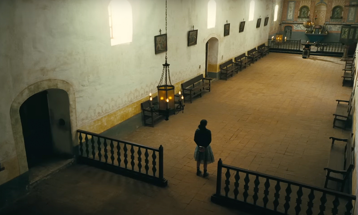 A still showing a woman in a church