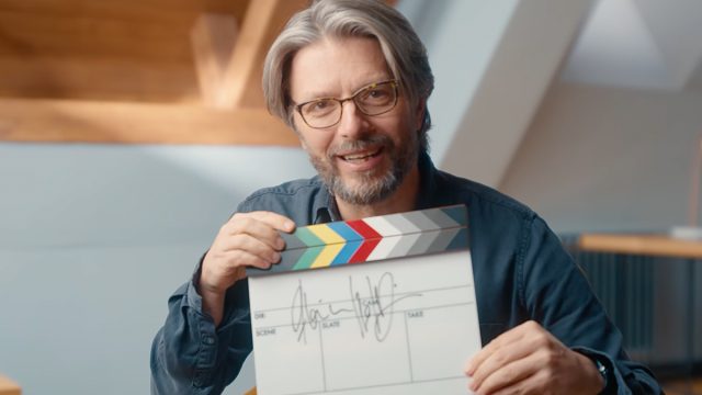 Florian Hoffmeister BSC holding a clapperboard