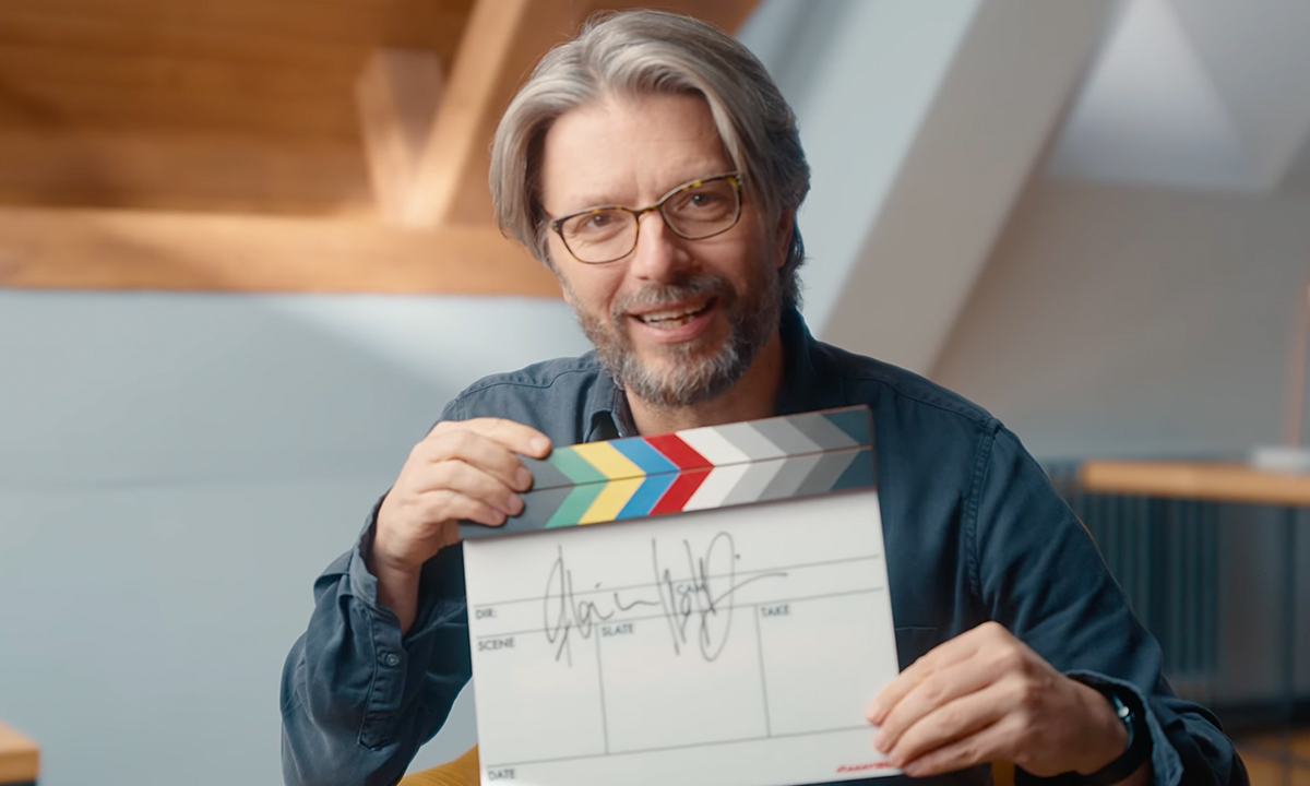 Florian Hoffmeister BSC holding a clapperboard