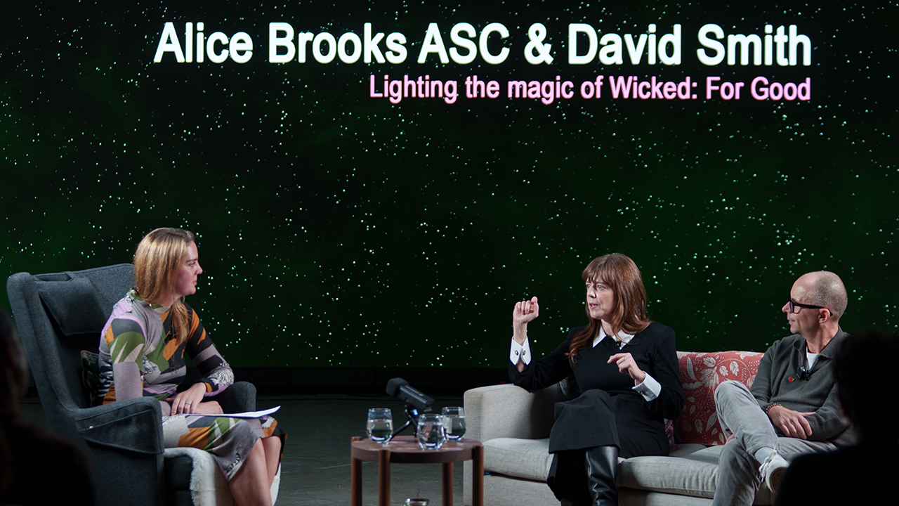 Three people sat together in a studio talking