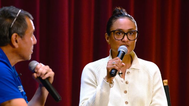 Autumn Durald Arkapaw sat talking into a microphone