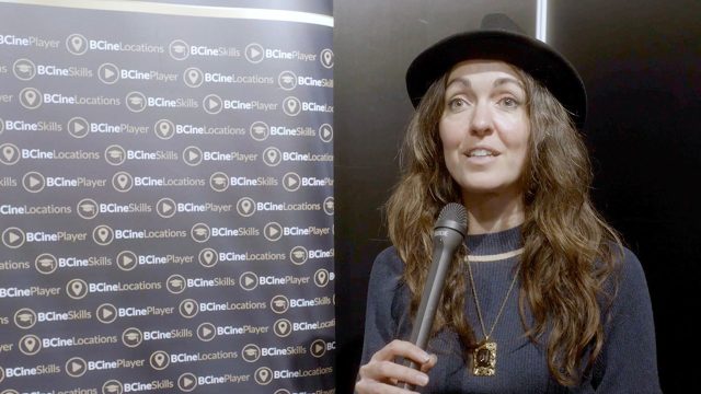 Ashley Barron holding a microphone