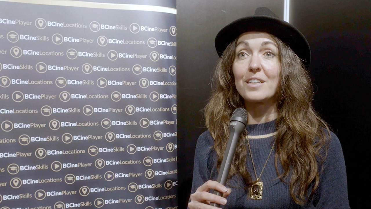 Ashley Barron holding a microphone