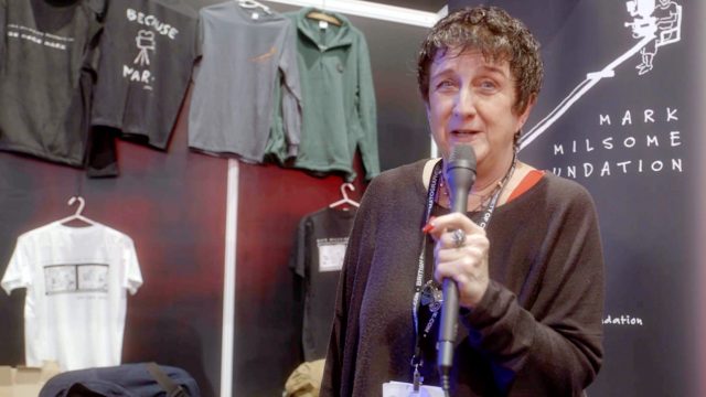 Andra Milsome holding a microphone