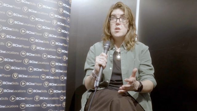 Zoe Goodwin holding a microphone