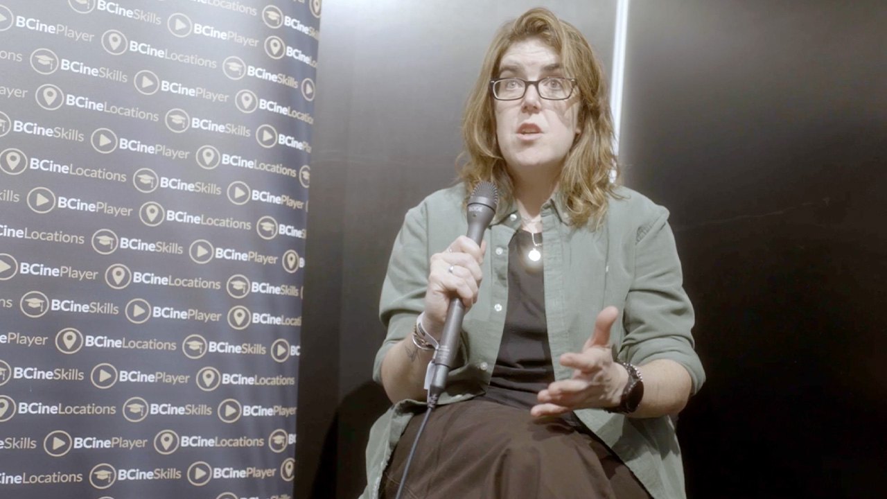 Zoe Goodwin holding a microphone