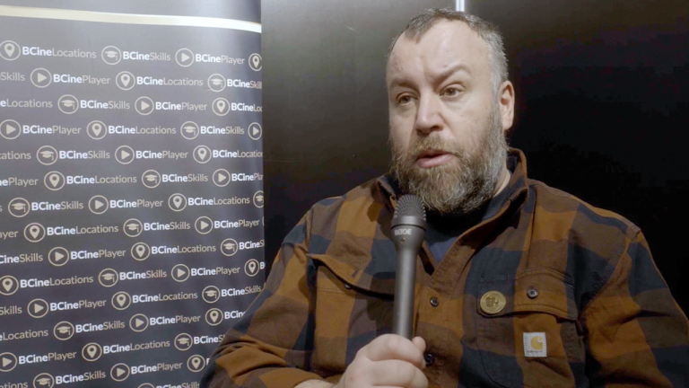 Stephen Murphy holding a microphone