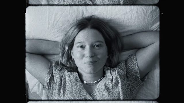 Lea Seydoux lying down and smiling