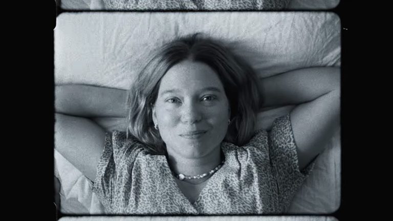 Lea Seydoux lying down and smiling