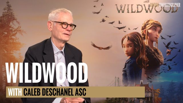 Caleb Deschanel sat in front of a Wildwood poster