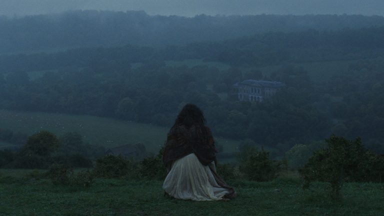 A woman sat on a hill